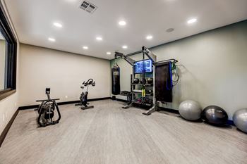 A well-equipped home gym with a variety of exercise equipment.